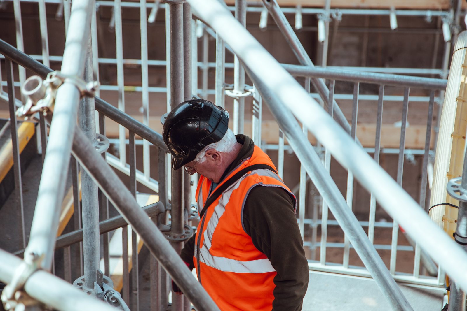 Construction worker on scaffolding at a building site
