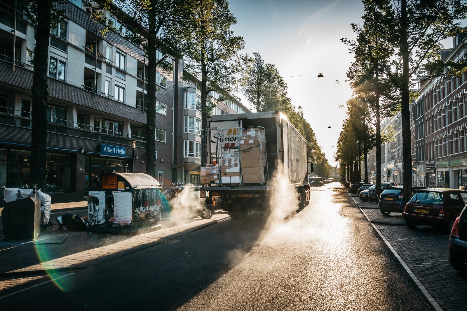 Delivery truck on a city street at sunrise